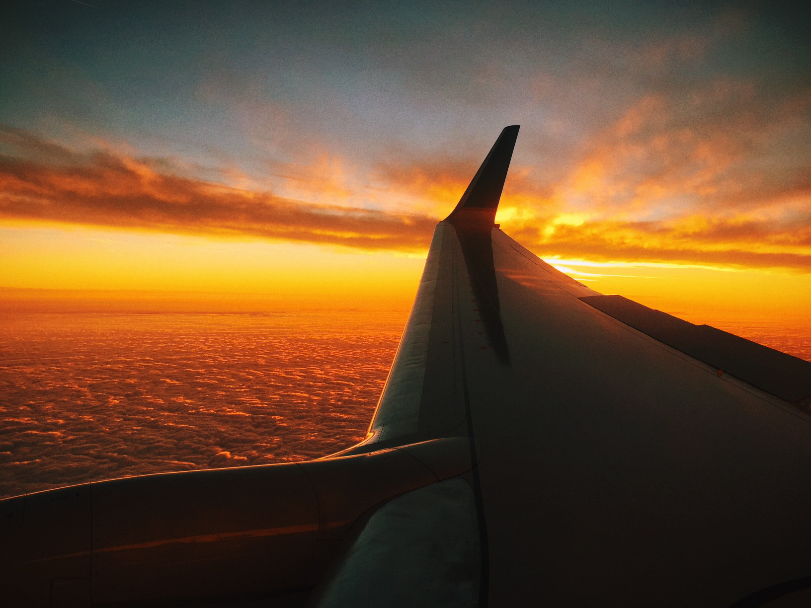 flight-sunset-red-clouds
